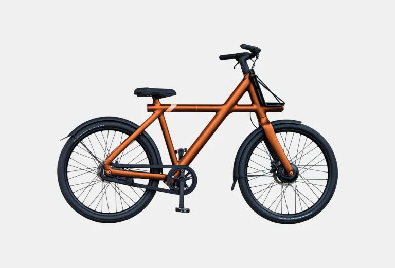 Modern orange bicycle with extended front frame, black accents, and disc brakes on white background.
